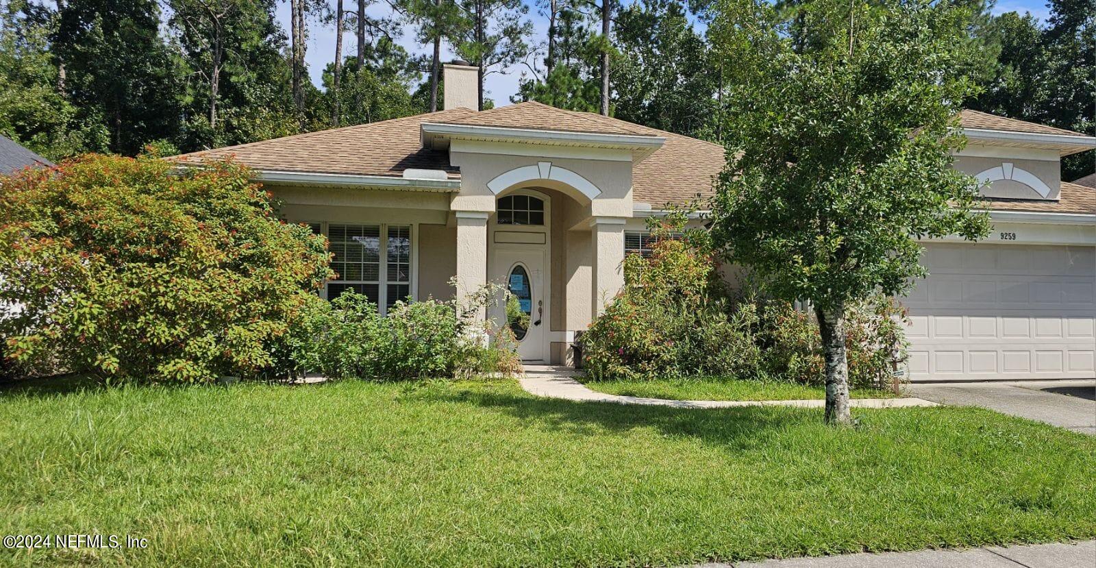 a front view of a house with a yard