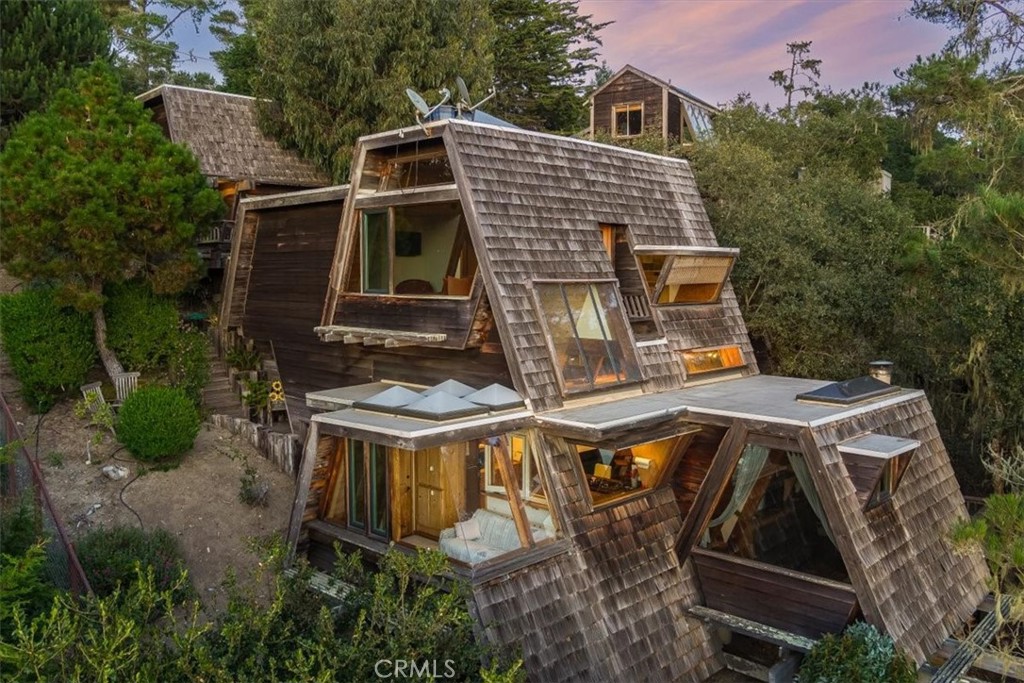 a aerial view of a house with a yard