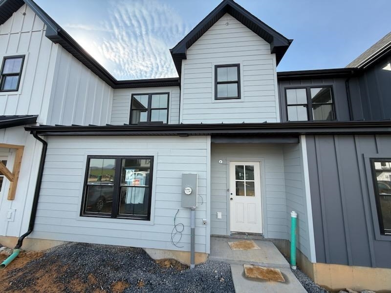 a front view of a house with a wooden fence