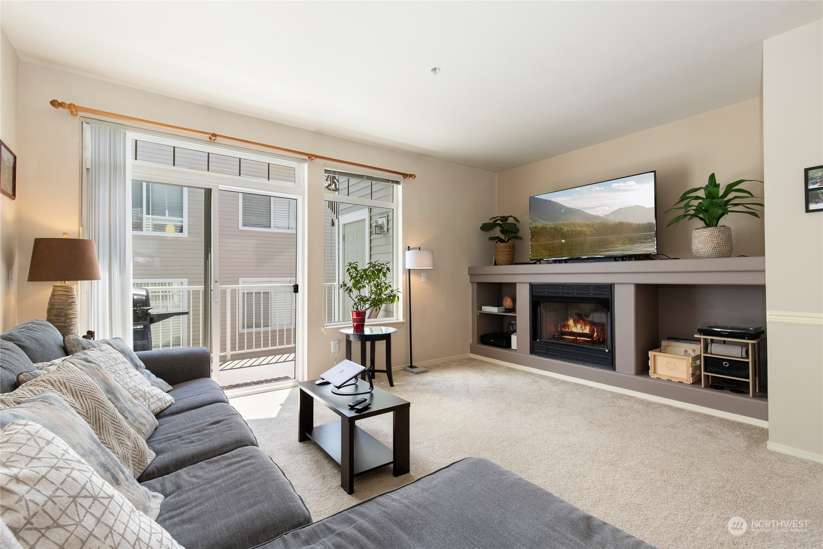 a living room with furniture and a fireplace