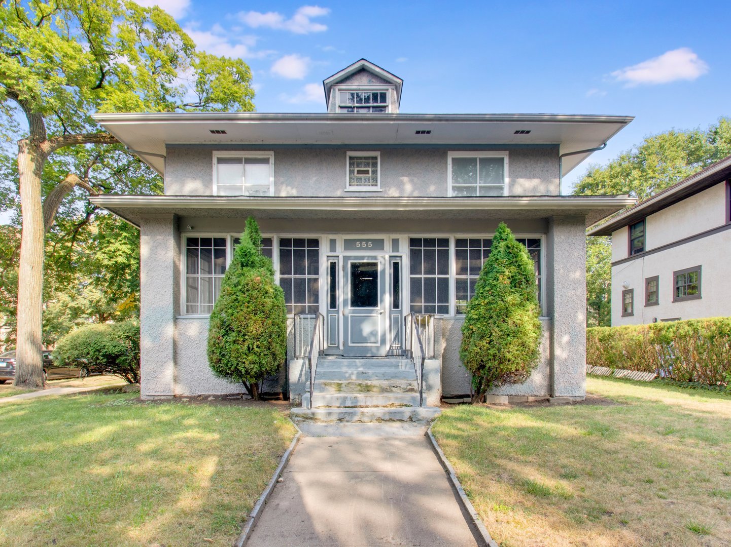 a front view of a house with garden