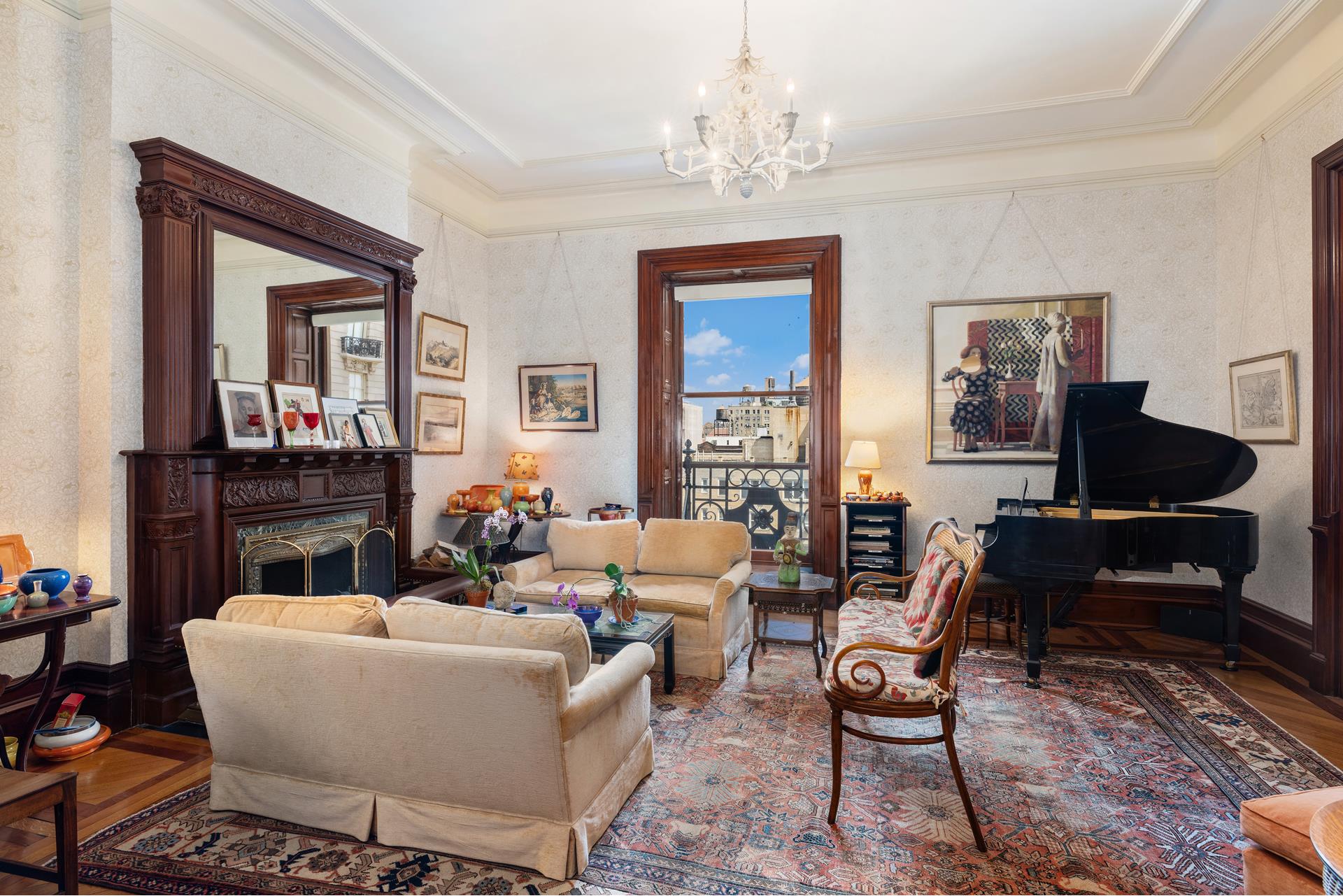 a living room with furniture and a chandelier