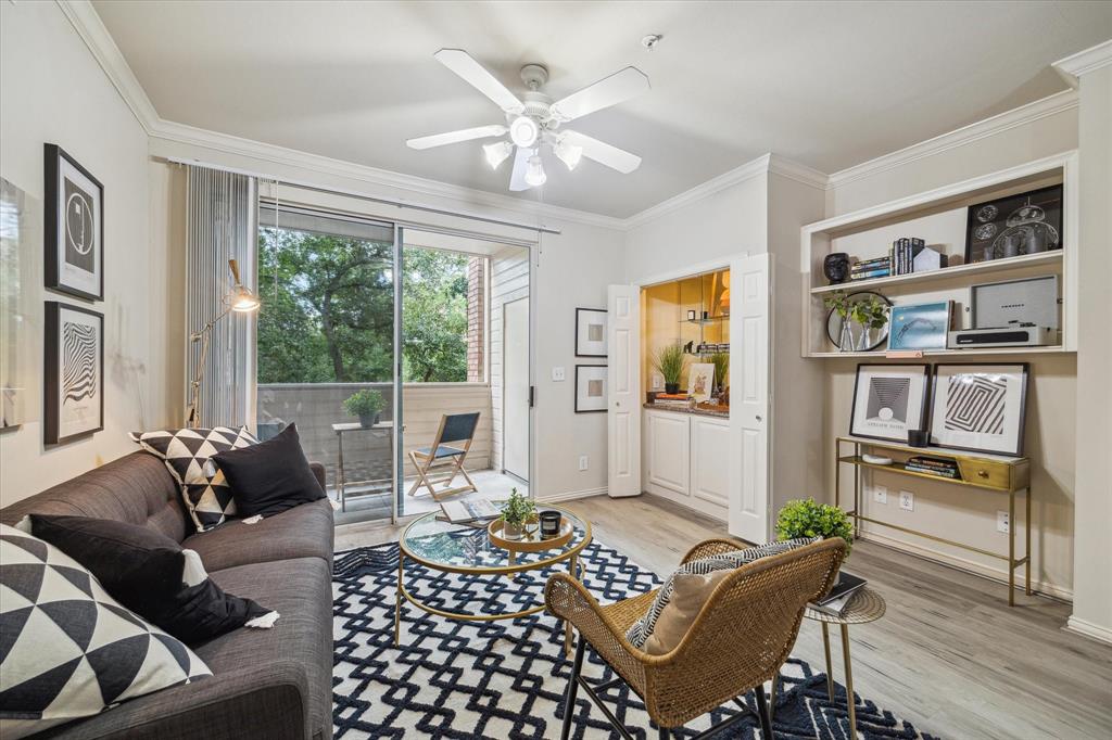 Living Area with dry bar and a great balcony with a tree framed view!