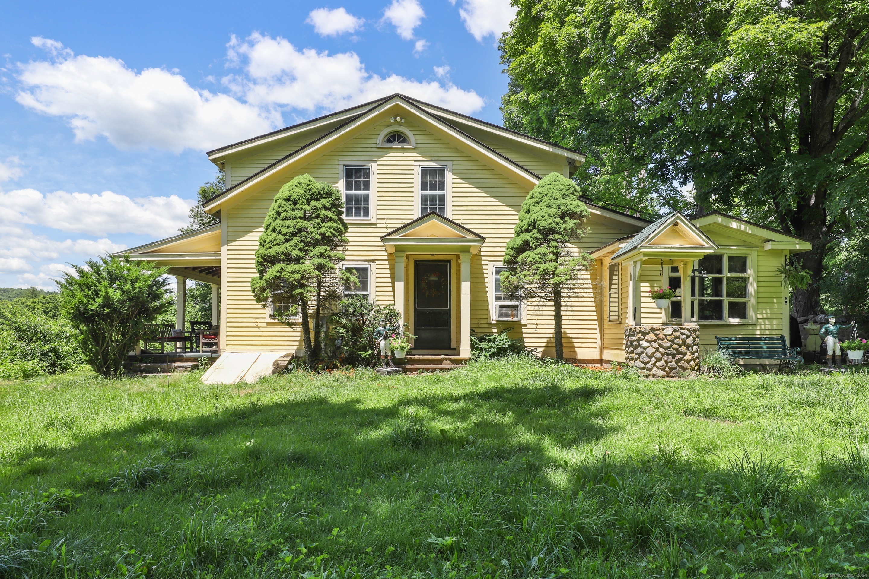 a front view of a house with a yard