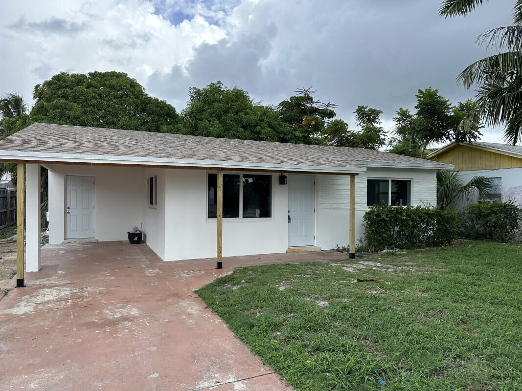 front view of a house with a yard