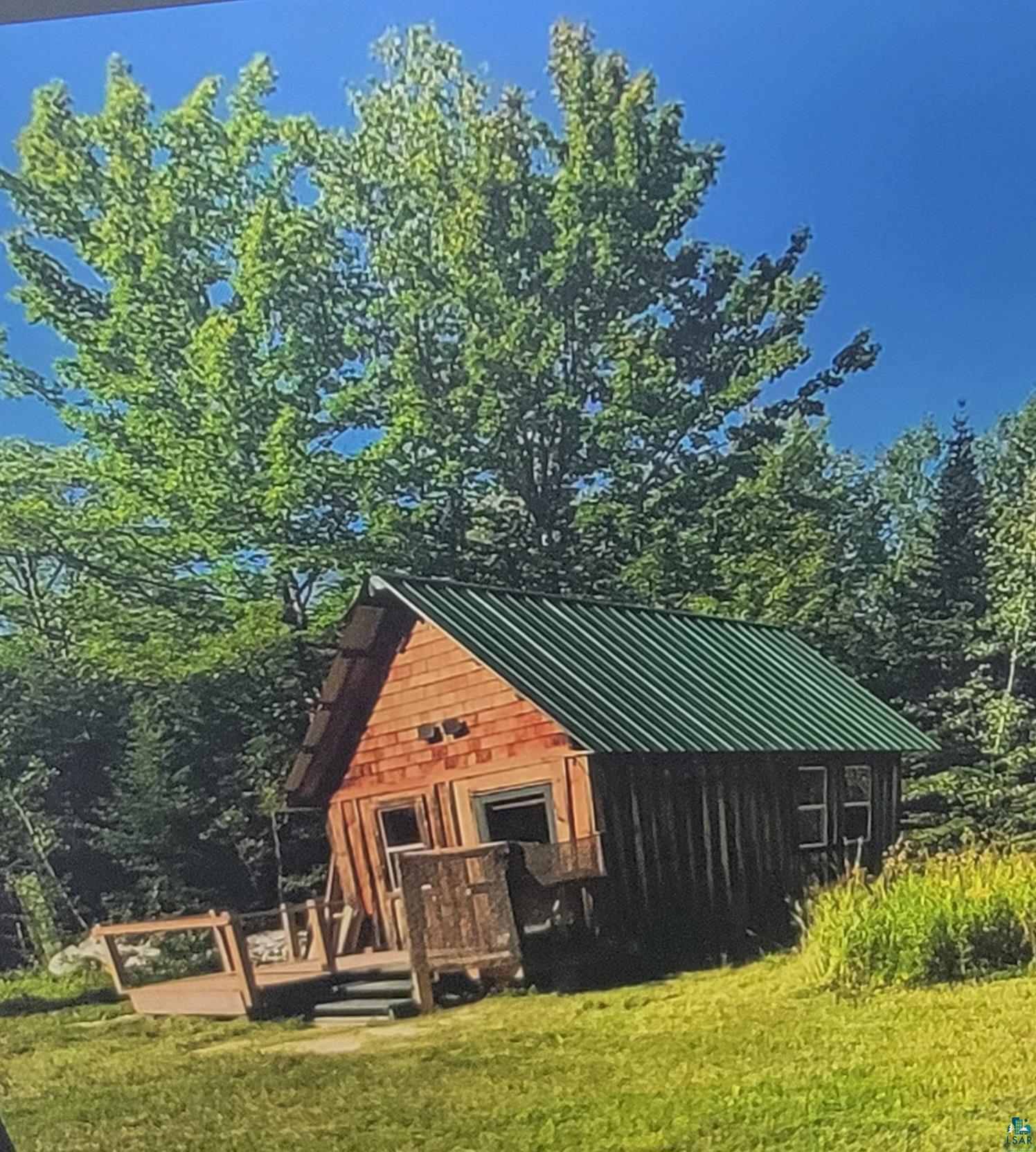 Back of house featuring a lawn