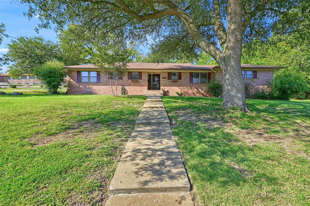 front view of a house with a yard