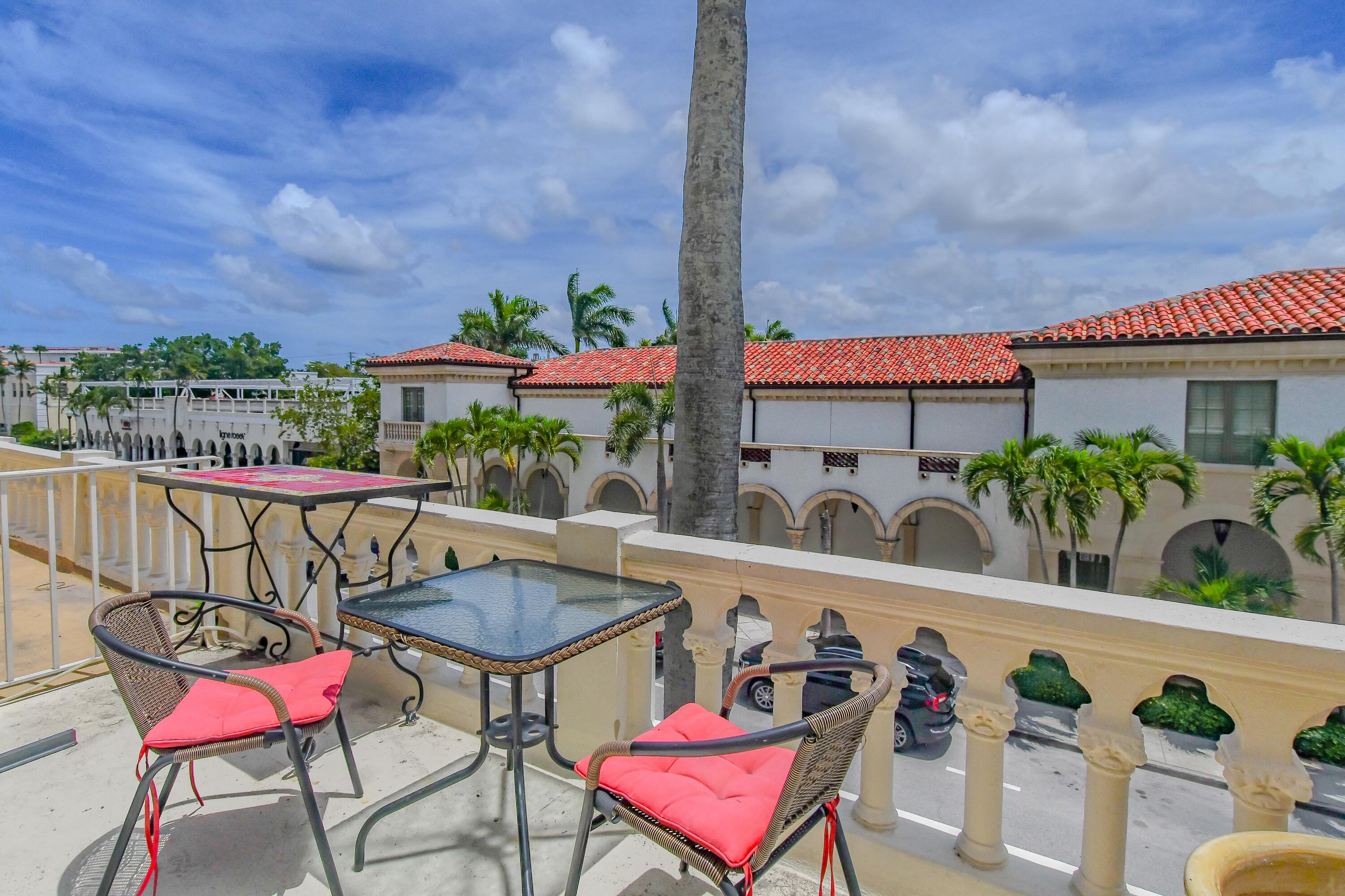 a view of a chairs and table in patio