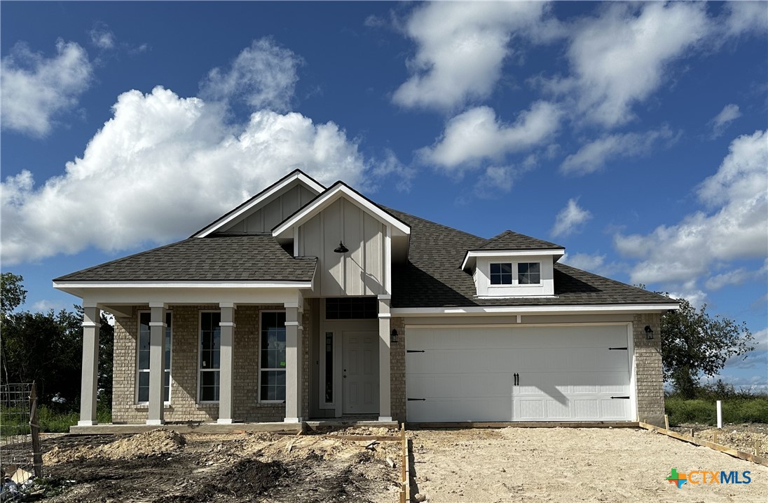 a front view of a house with yard