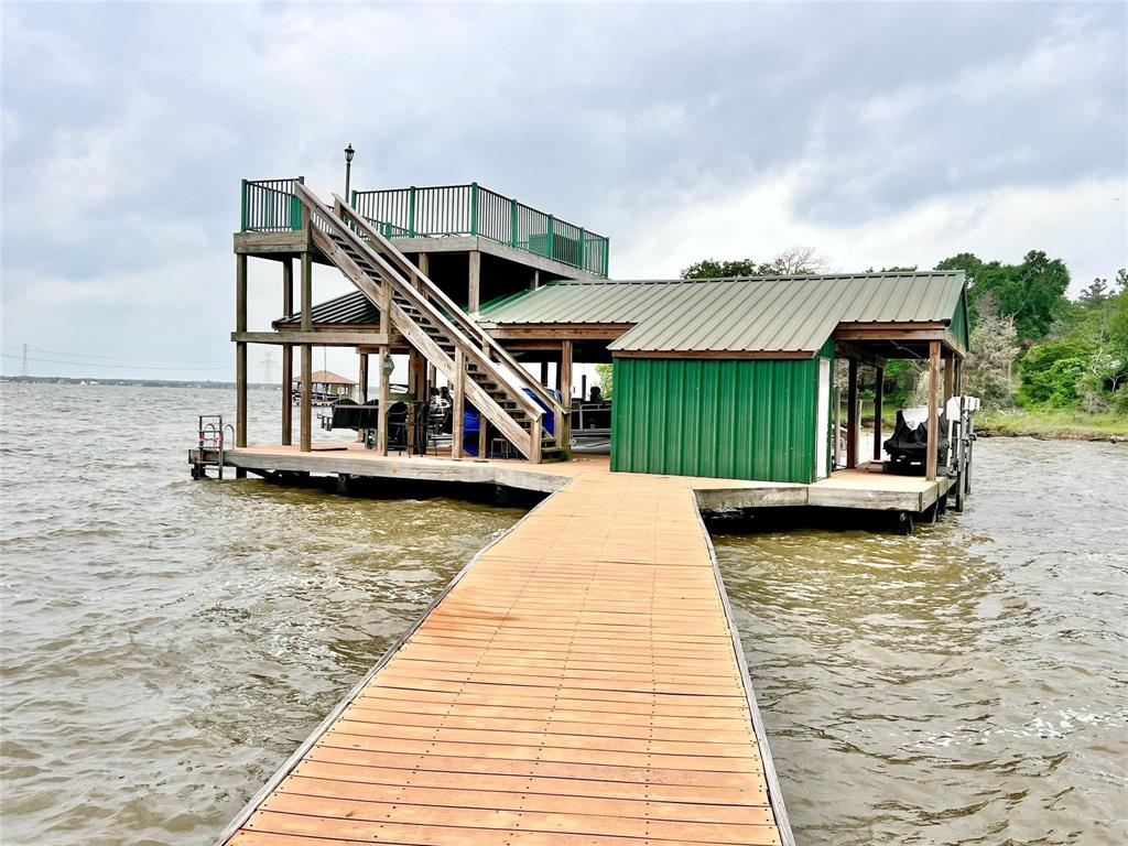 a view of a house with a wooden deck