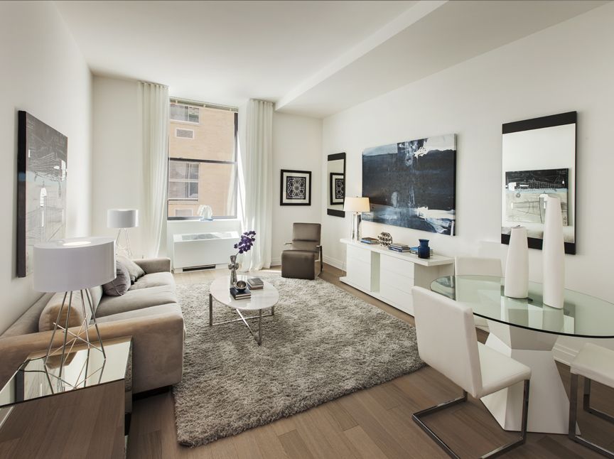 a living room with fireplace furniture and a flat screen tv