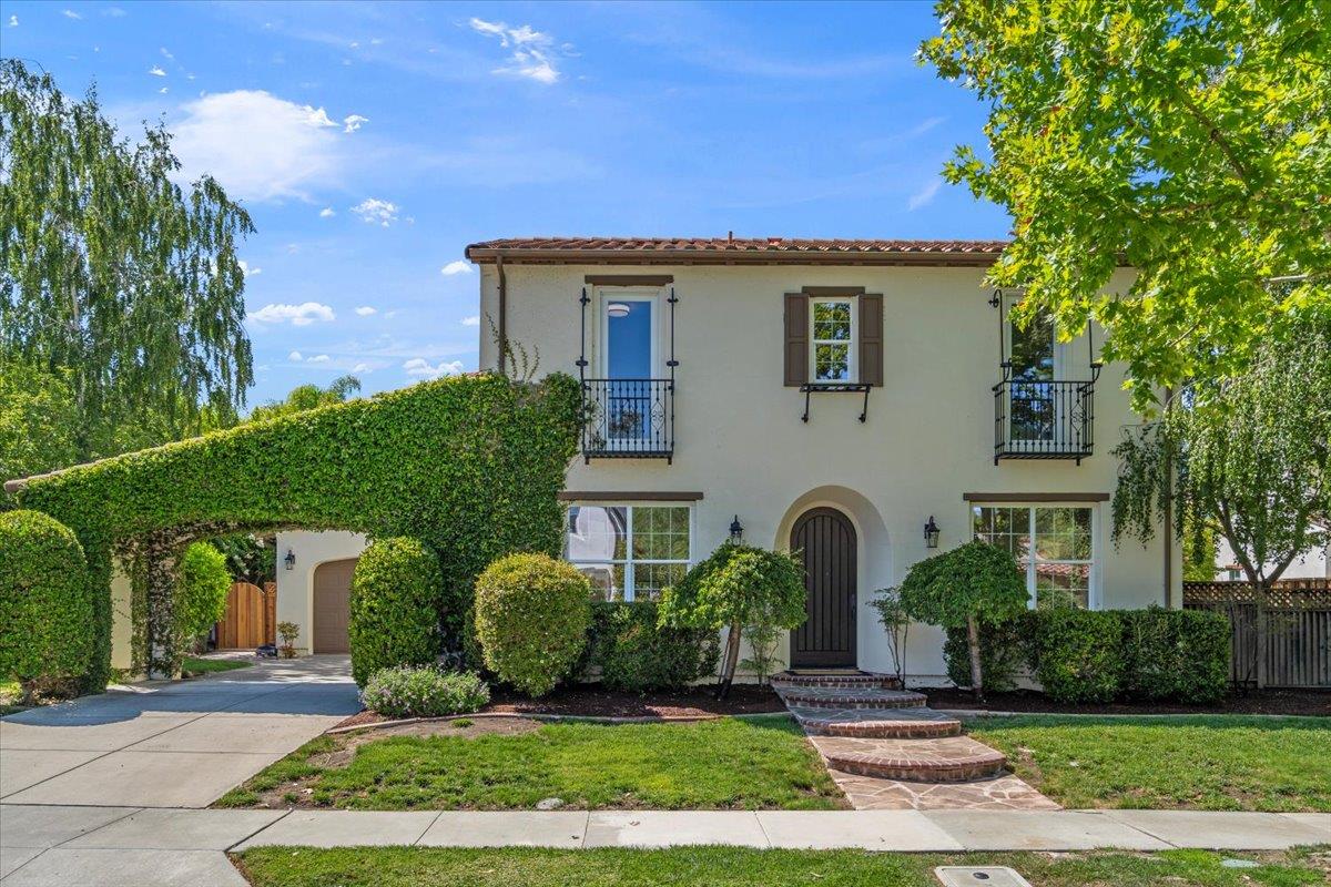 a front view of a house with garden