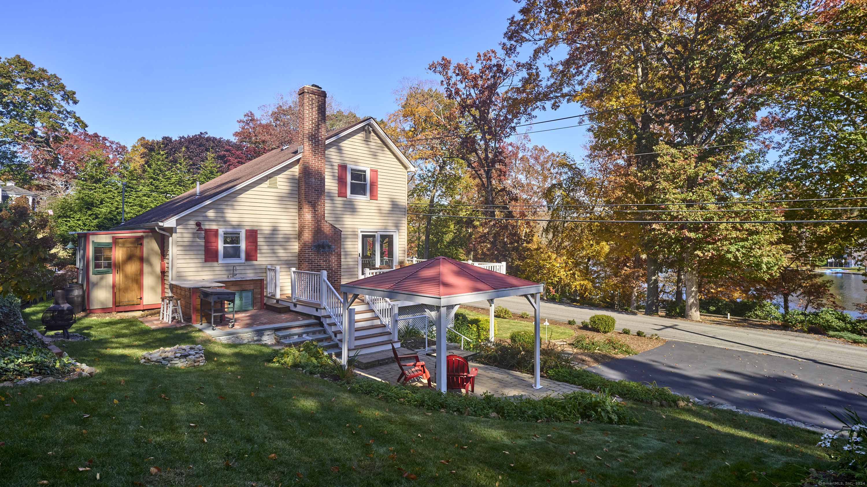 a view of a house with a yard porch and sitting area