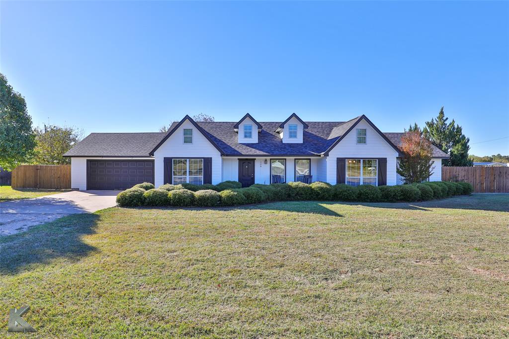 a front view of a house with yard