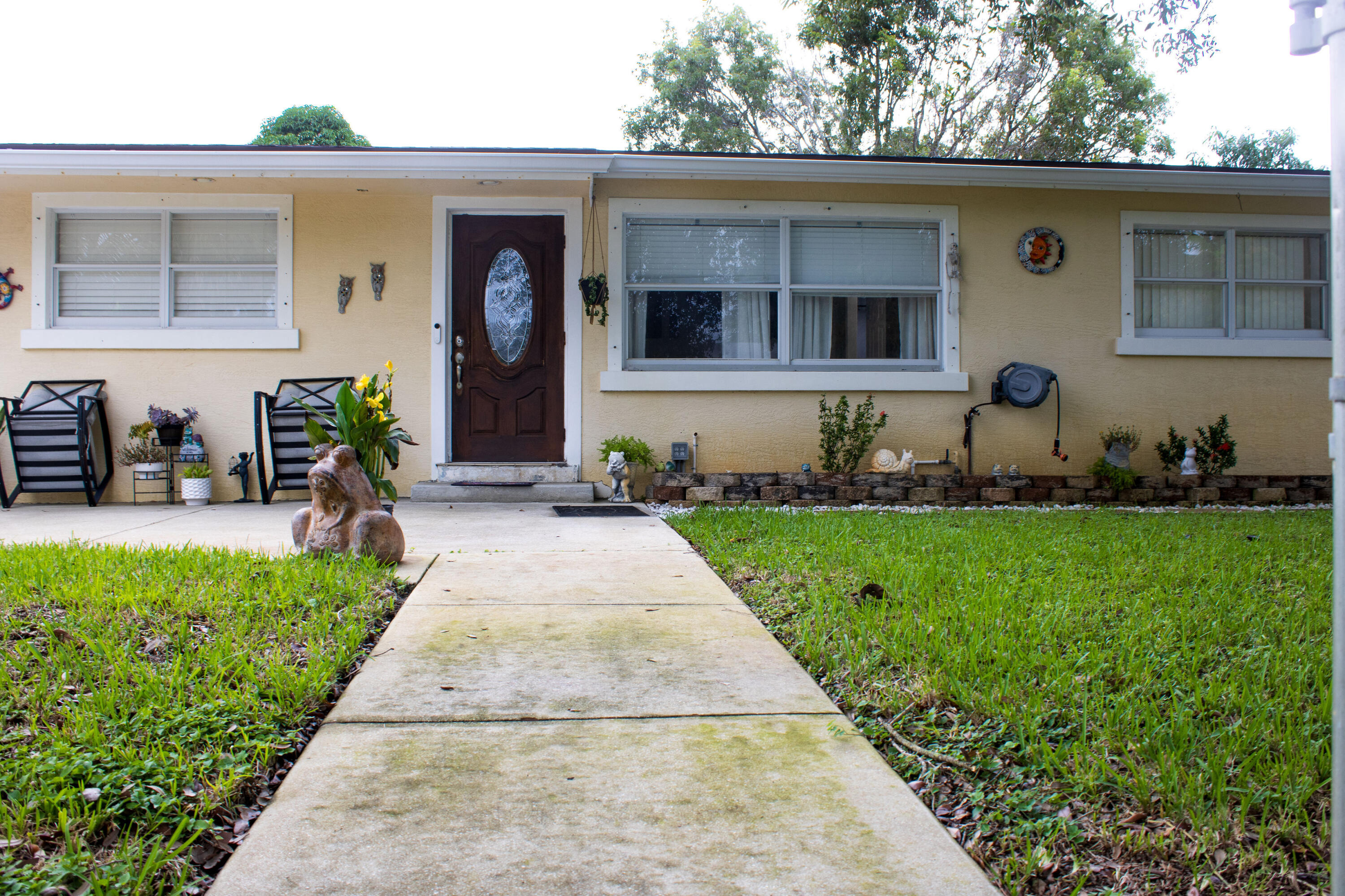 a front view of a house with garden