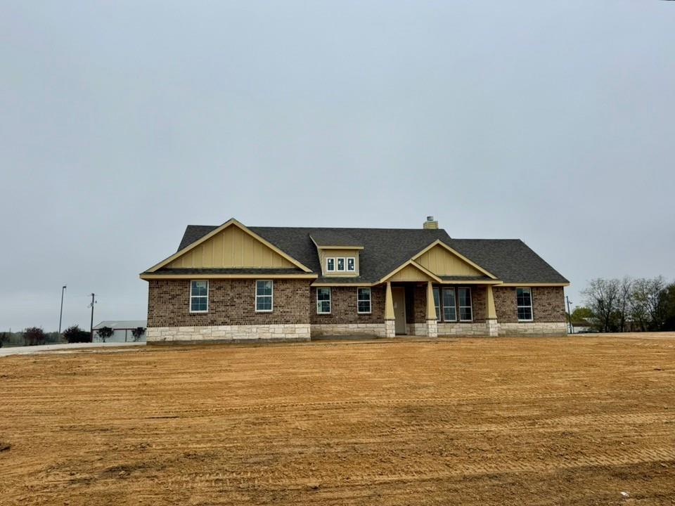 a front view of a house with a boat