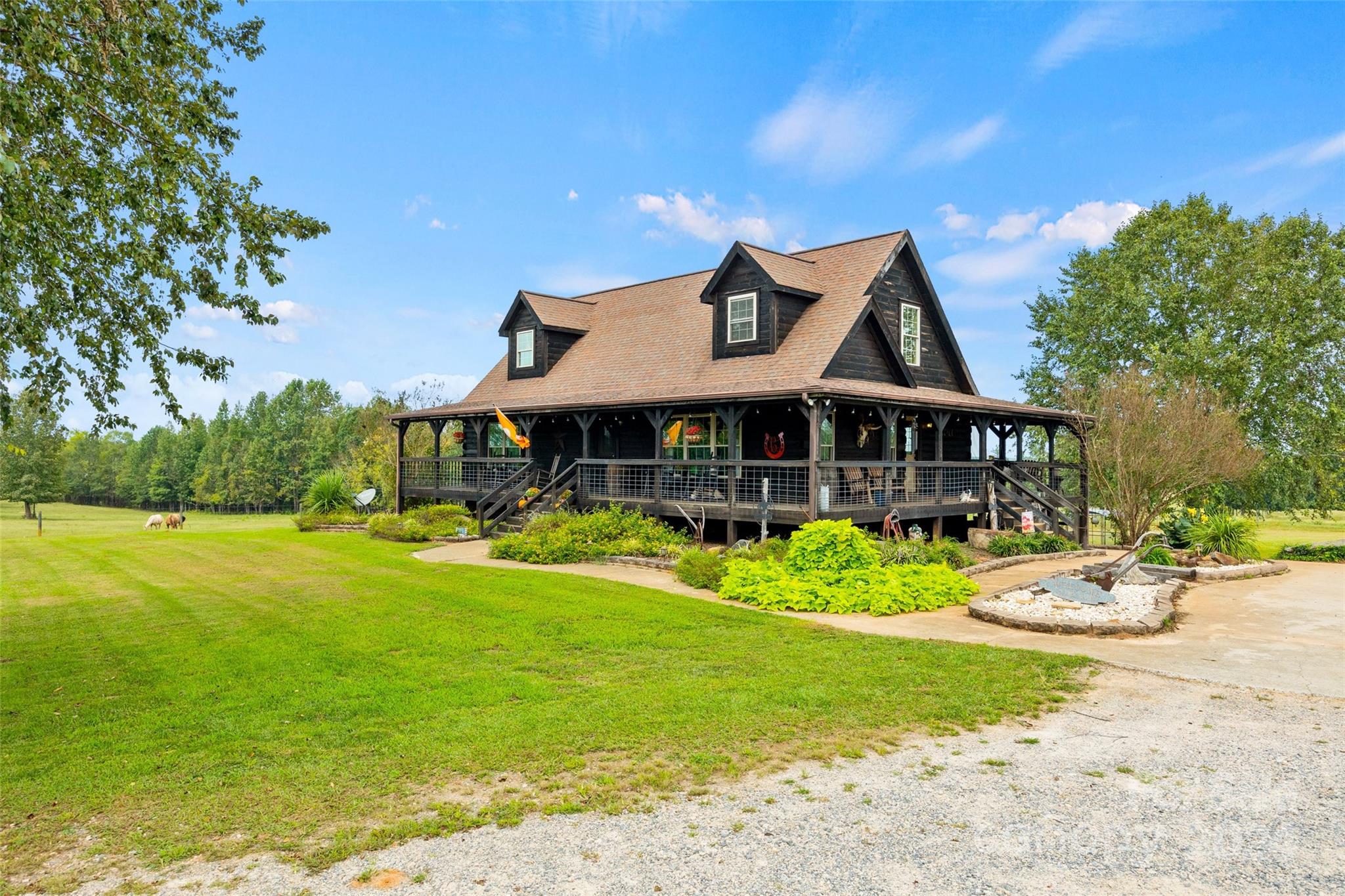 a front view of a house with swimming pool having outdoor seating