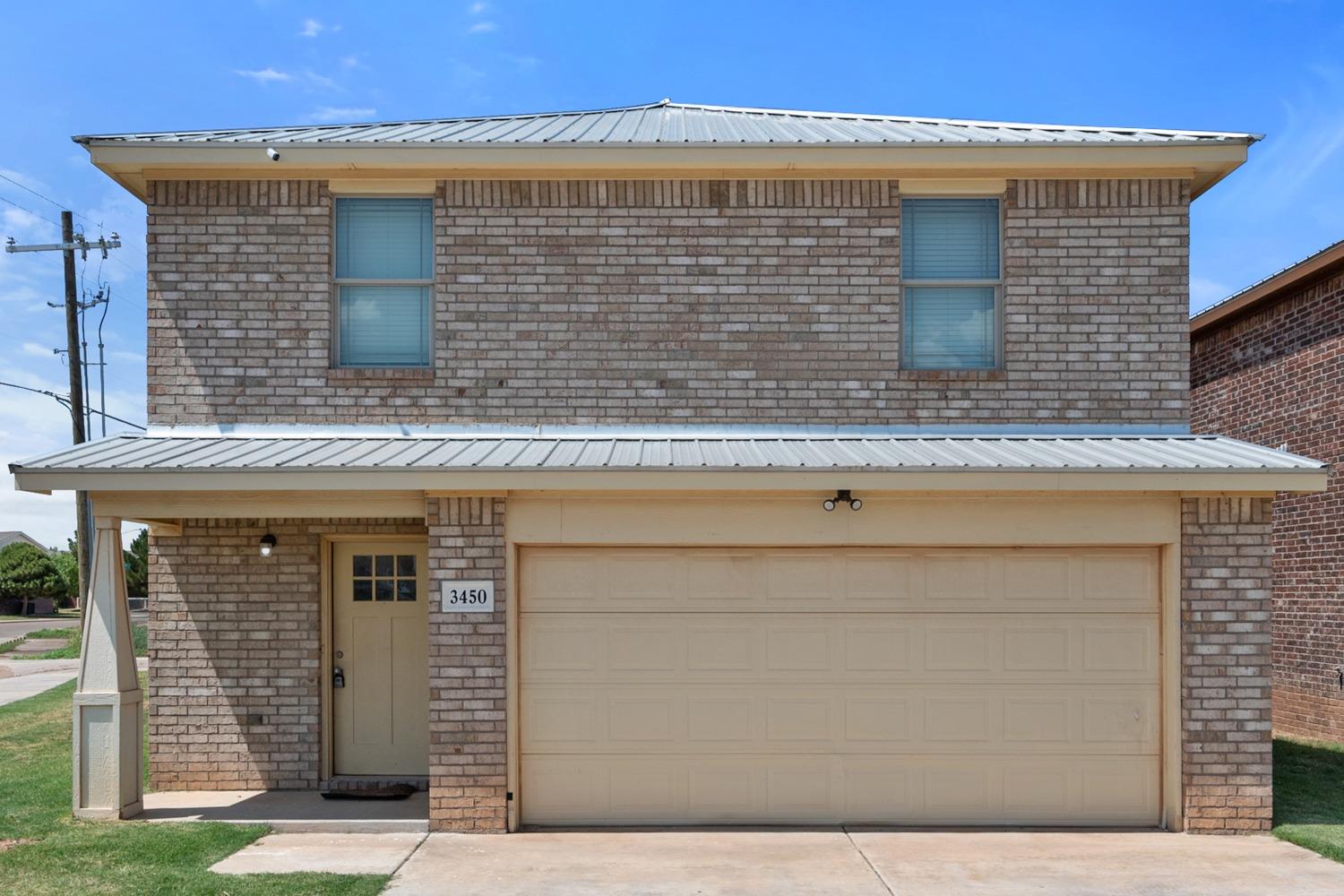 a front view of a house with brick walls