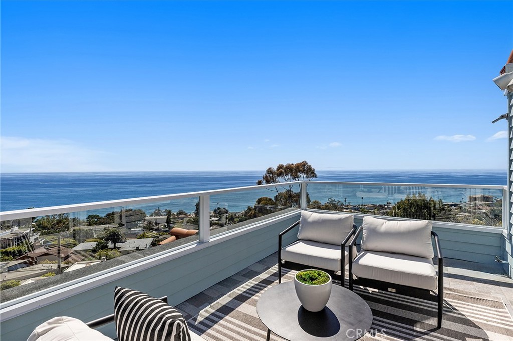 a view of roof deck with seating area and barbeque oven