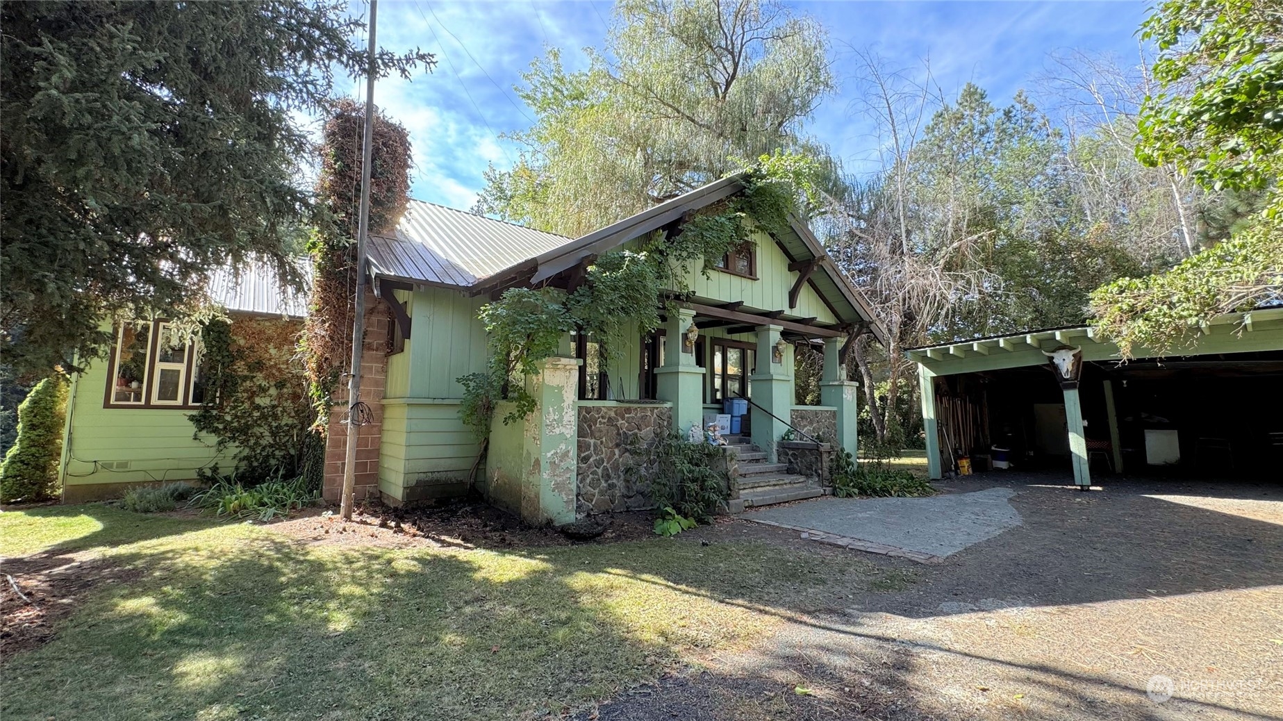 front view of a house with a yard