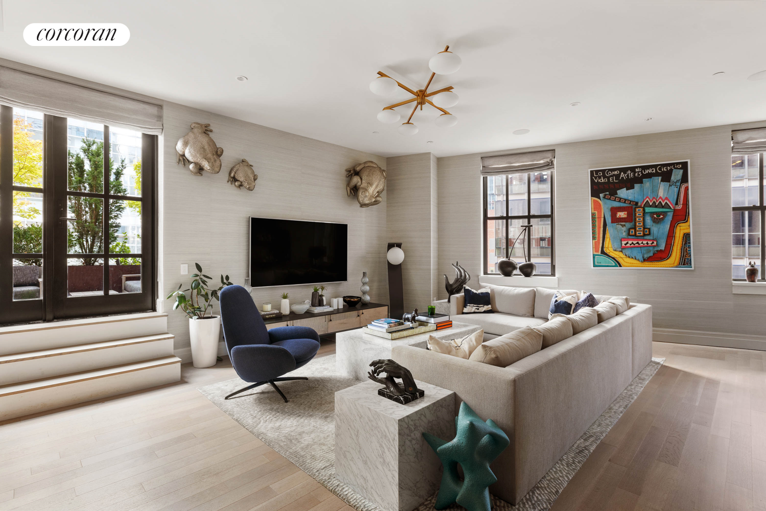 a living room with furniture and a flat screen tv