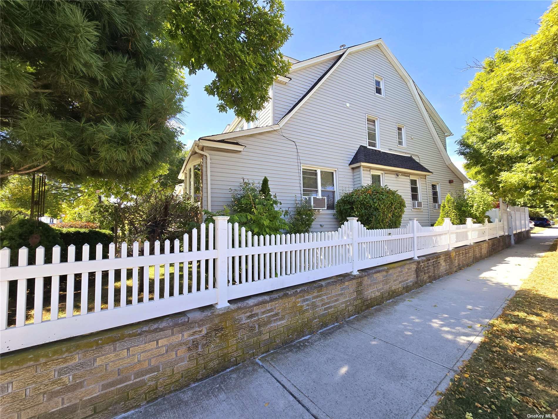 a view of a house with a small yard