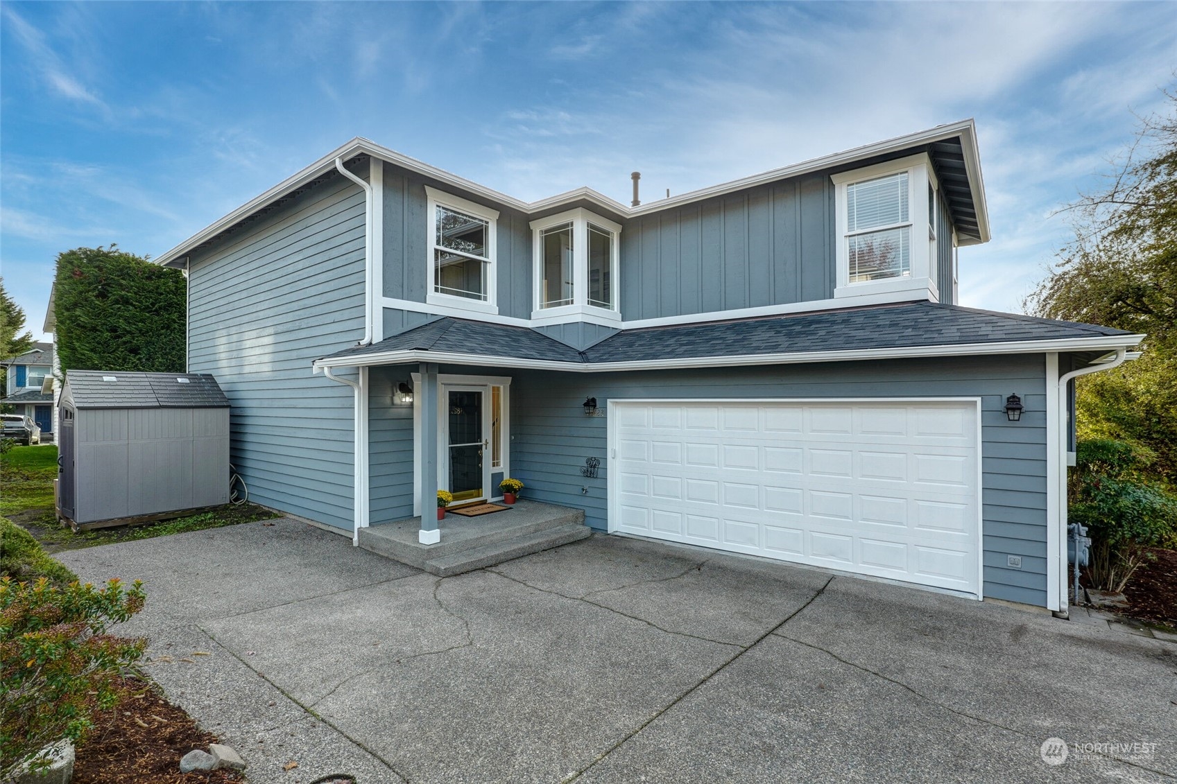 a front view of a house with garage