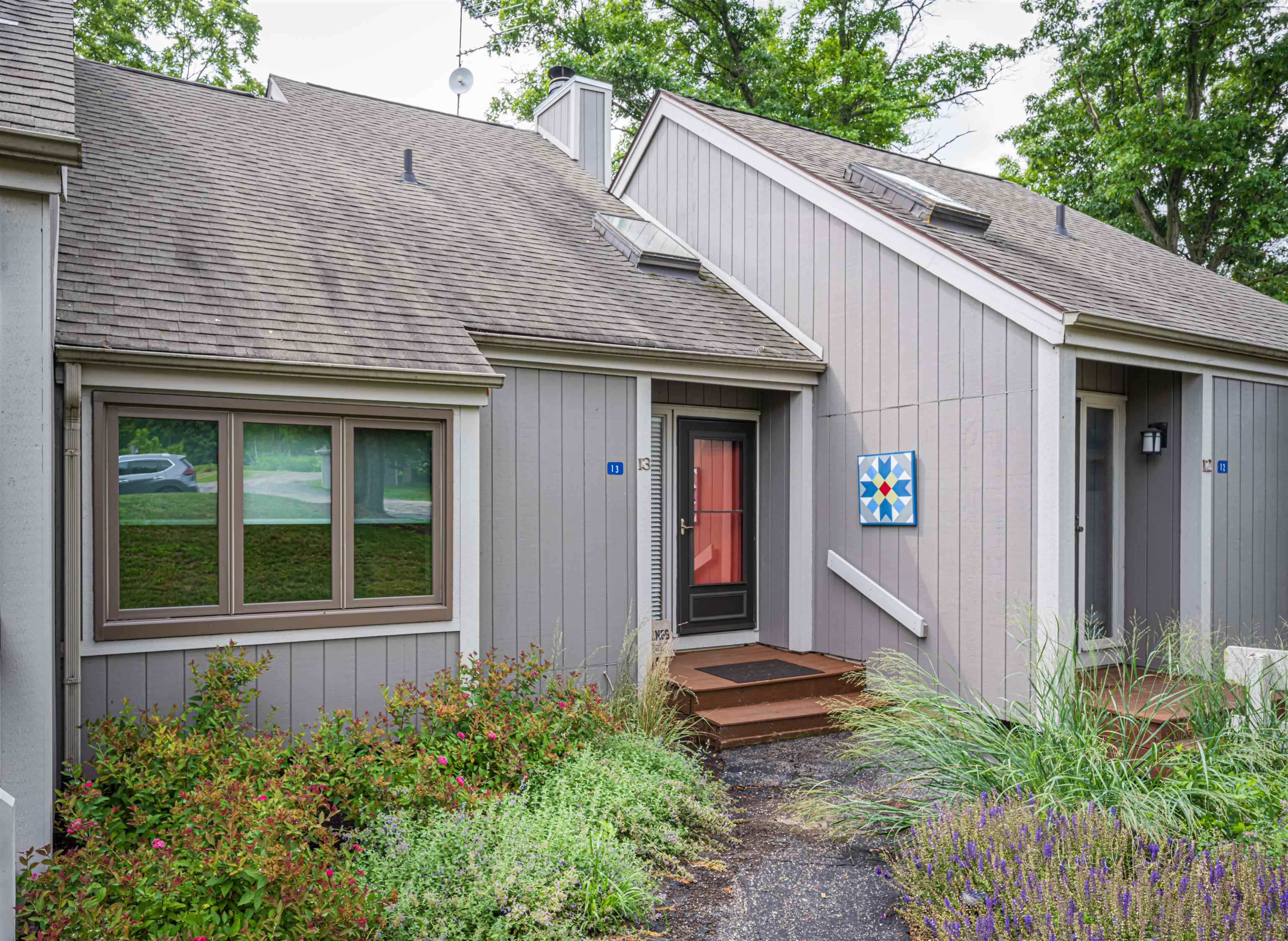 a front view of a house with garden