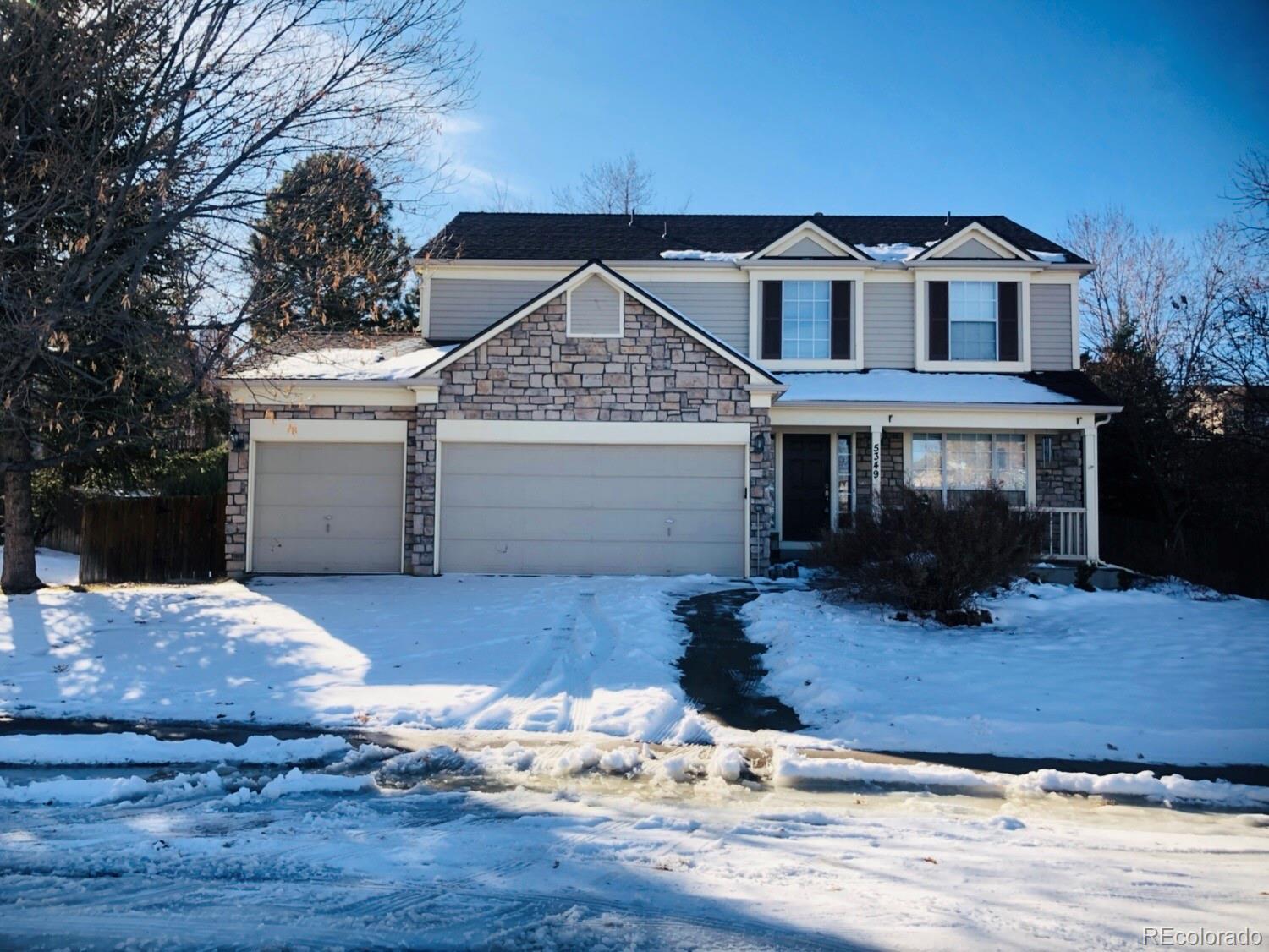 a front view of a house with yard