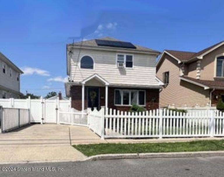 a view of a house with a small yard