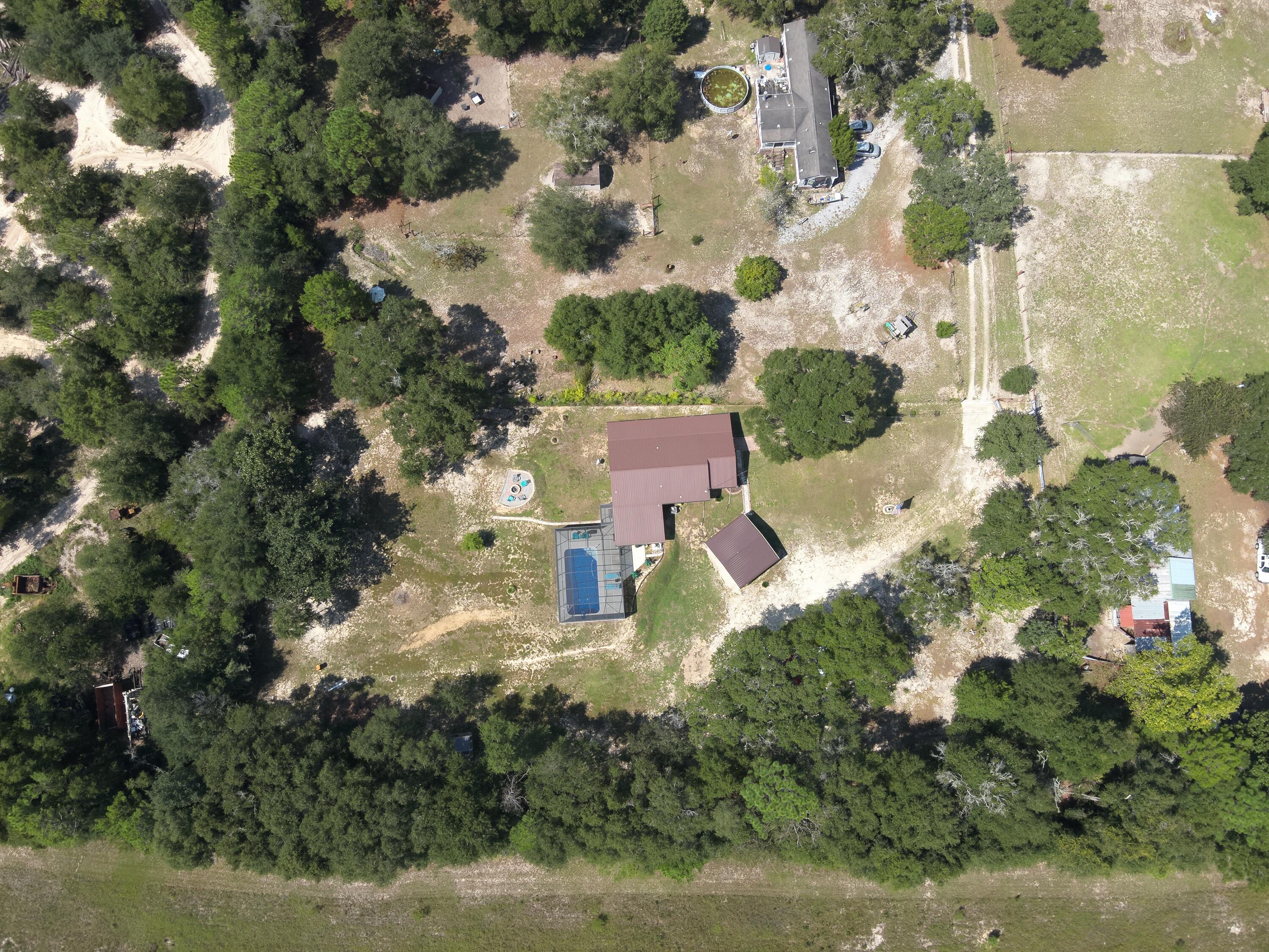 an aerial view of residential houses with outdoor space