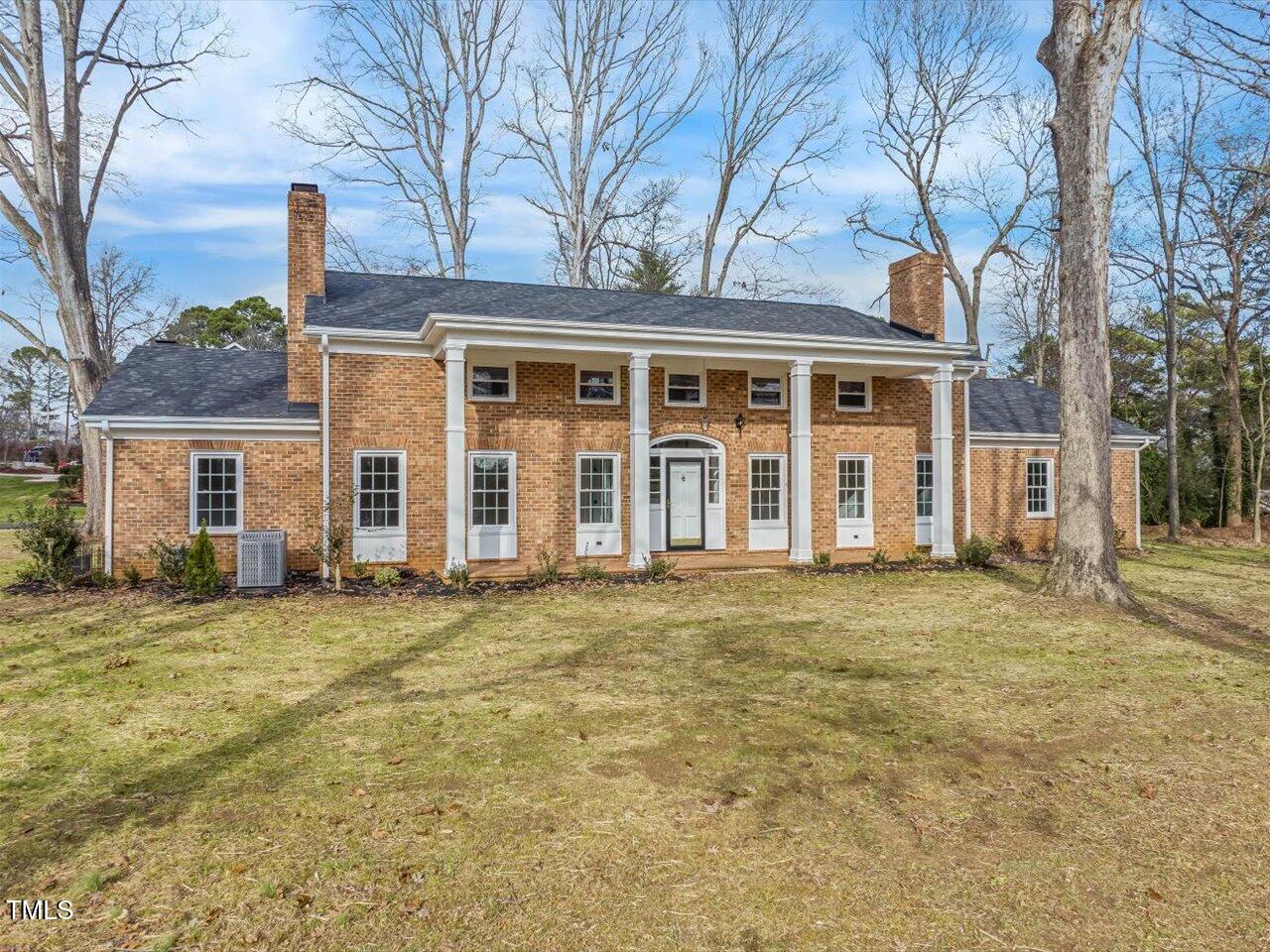 front view of a house with a garden