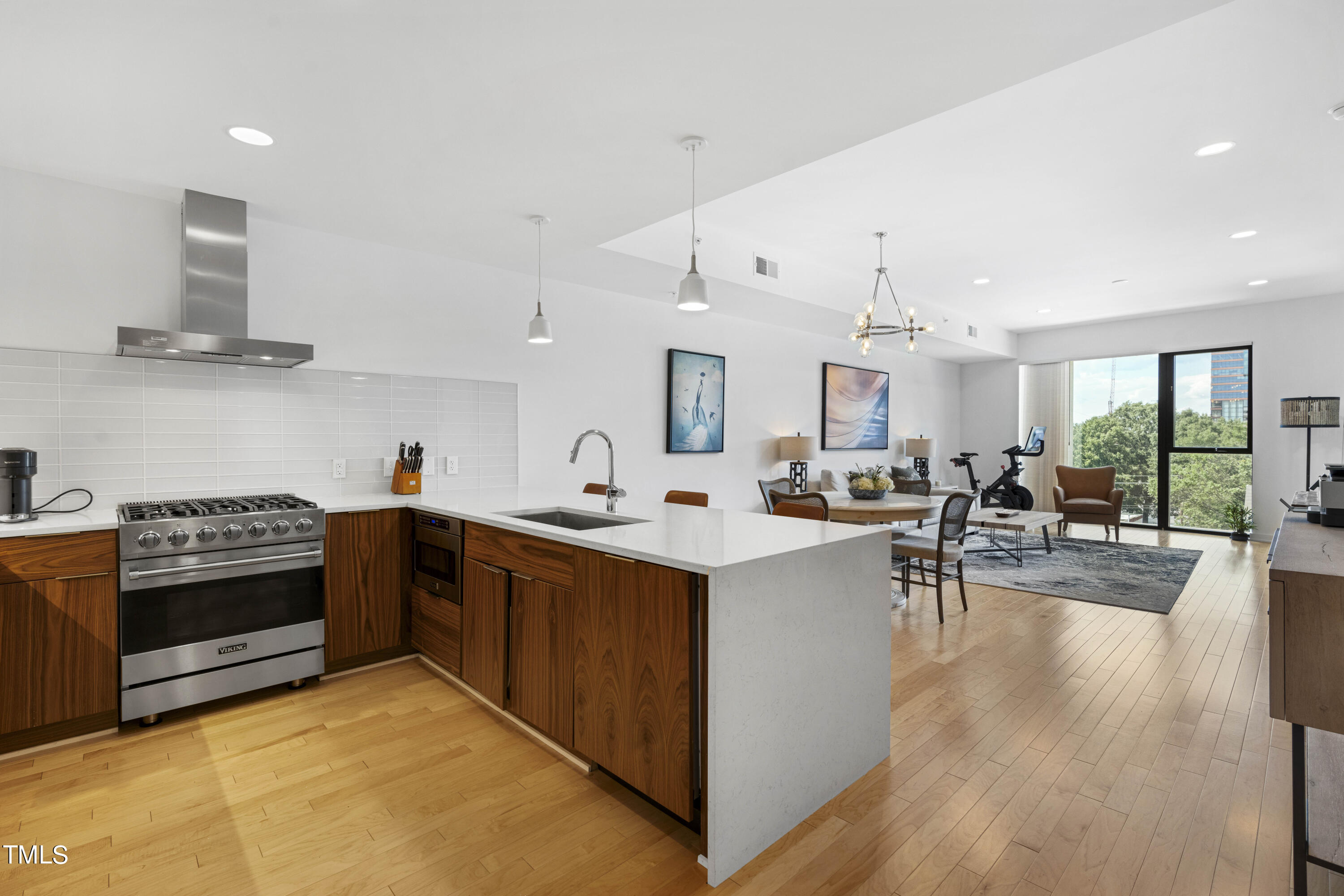 a kitchen with lots of counter top space and living room