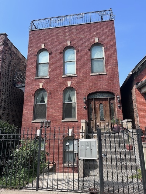 a front view of a building with glass windows