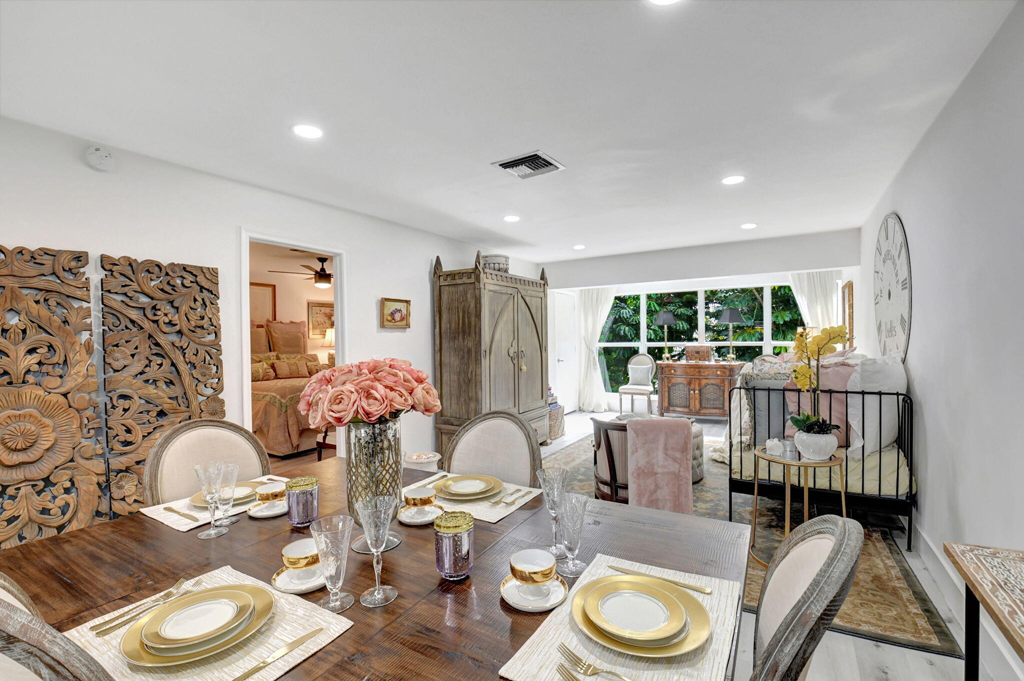 a dining room with furniture a rug and wooden floor