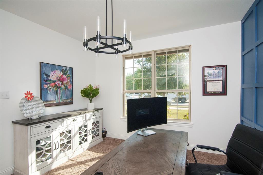 a view of a livingroom with furniture and a window