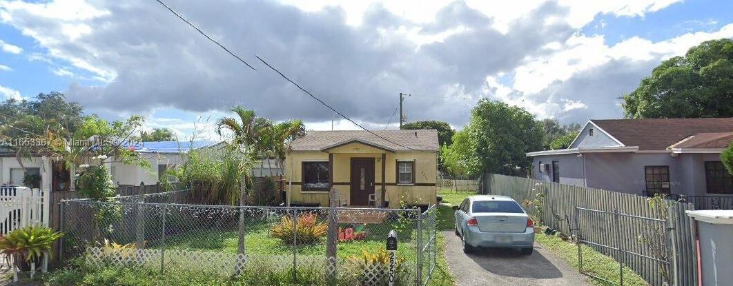 a front view of house with yard and outdoor seating