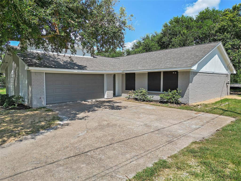 a backyard of a house with garage and a garage