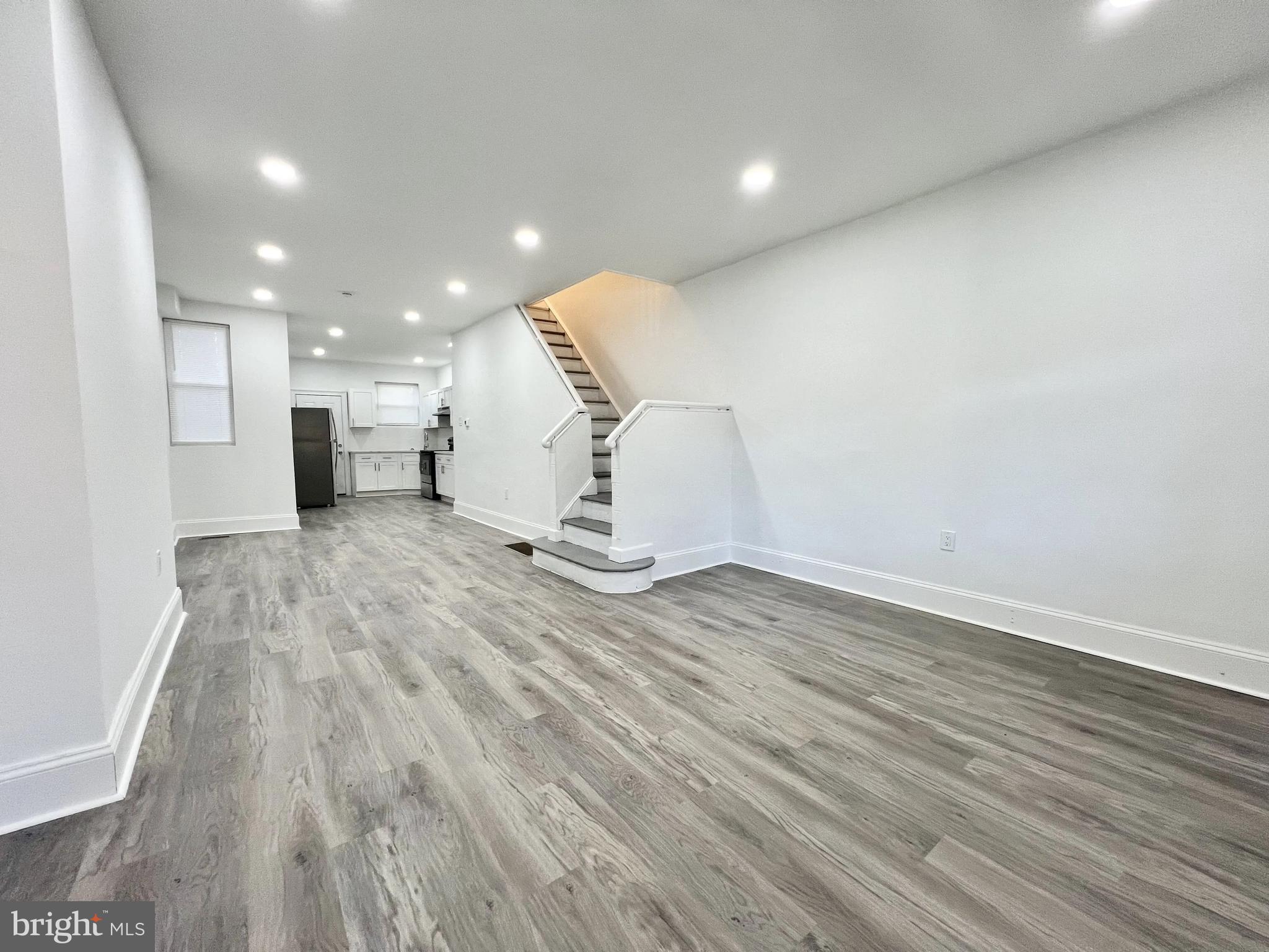 a view of a livingroom with wooden floor