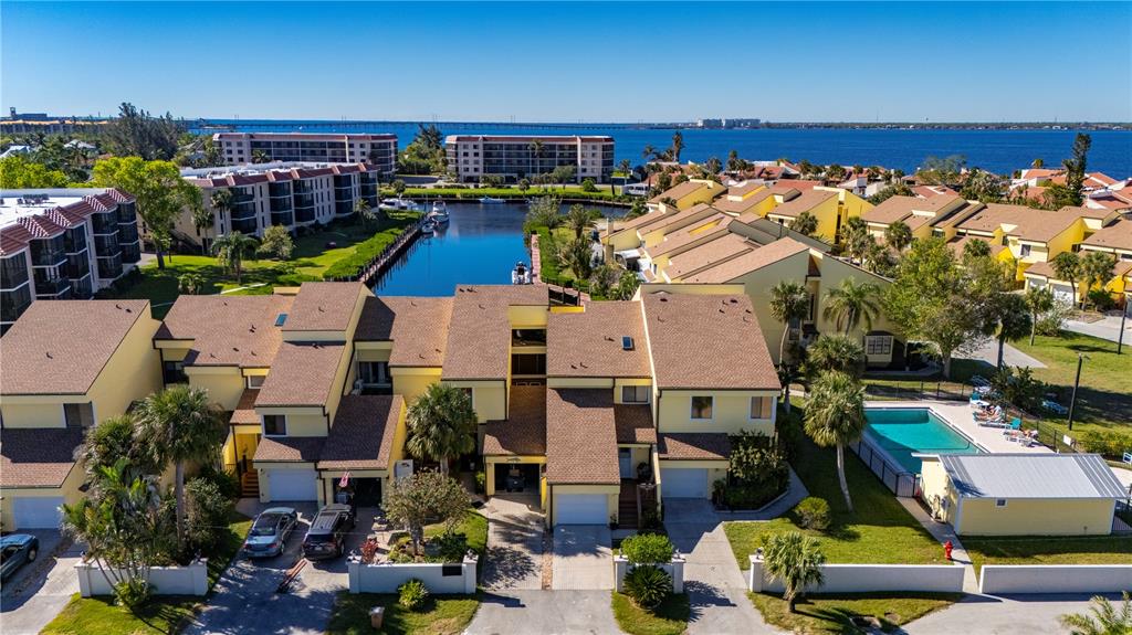 an aerial view of a houses with a swimming pool