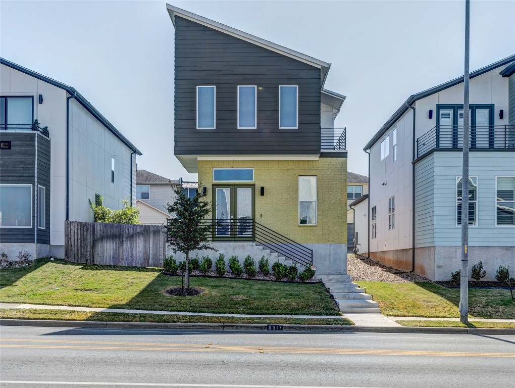 a view of a house with a street