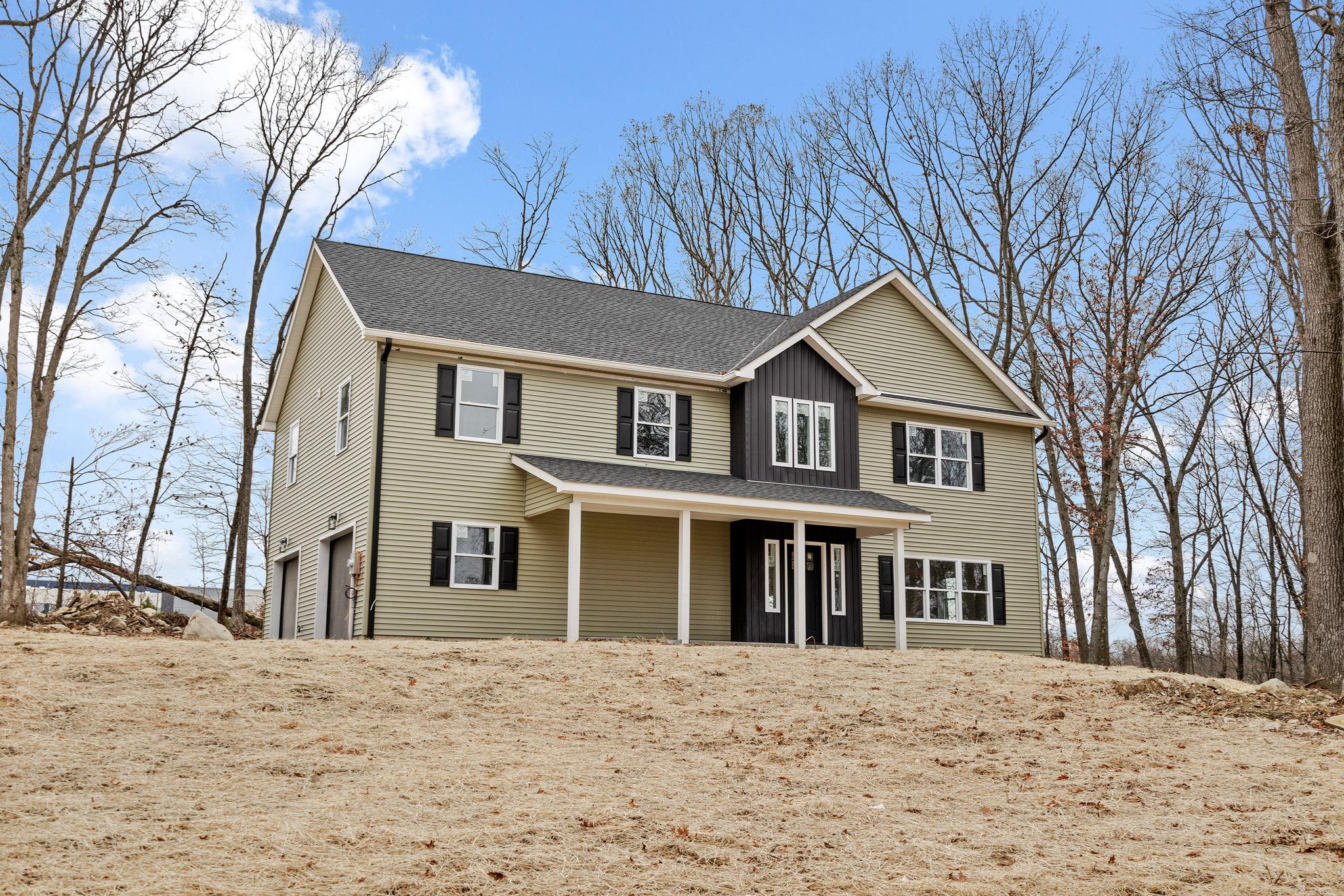 View of front of home featuring a garage