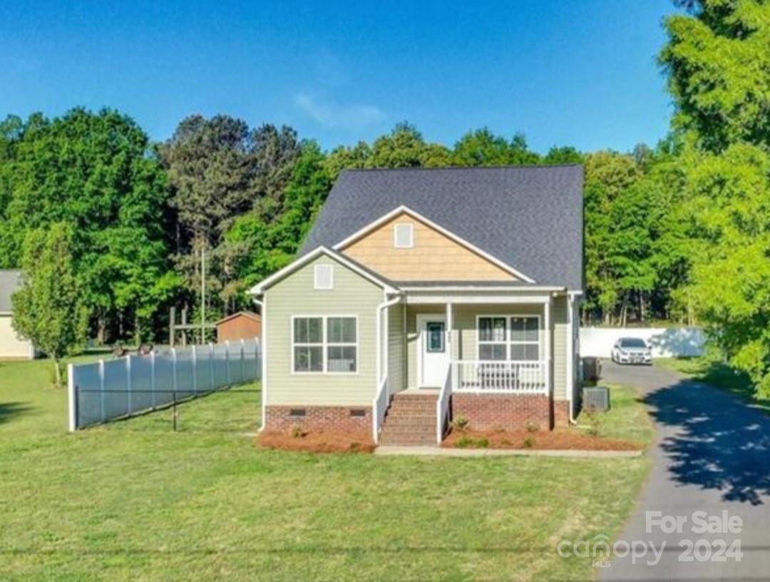 front view of a house with a yard