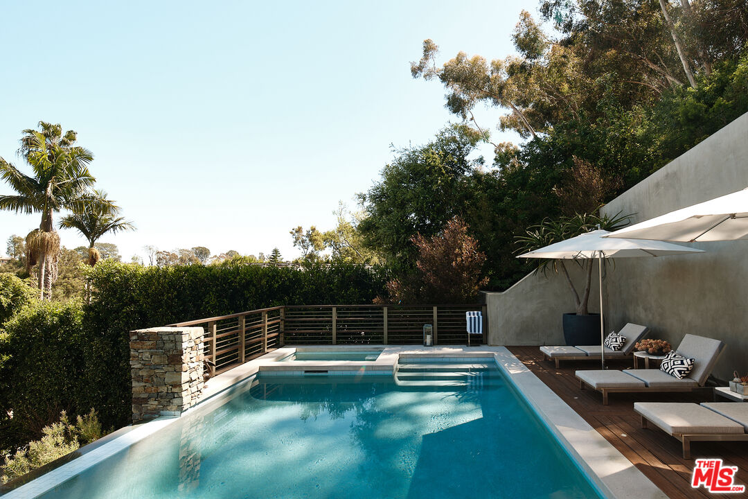 a view of a swimming pool with a patio