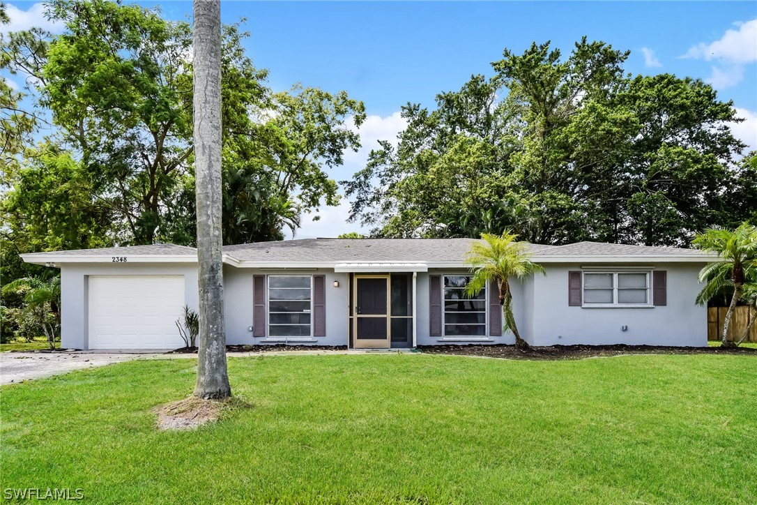 front view of a house with a yard