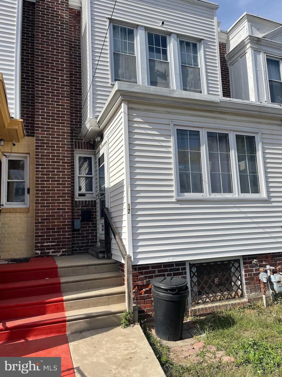 a front view of a house with stairs