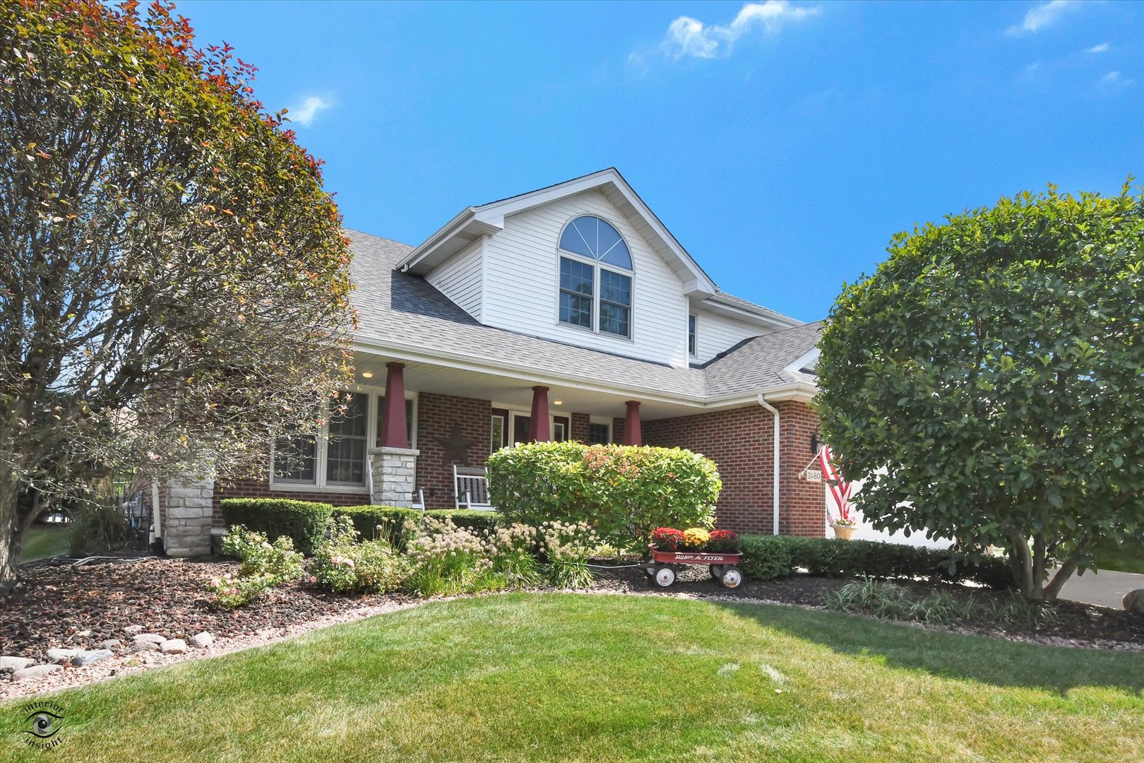 a front view of a house with a yard