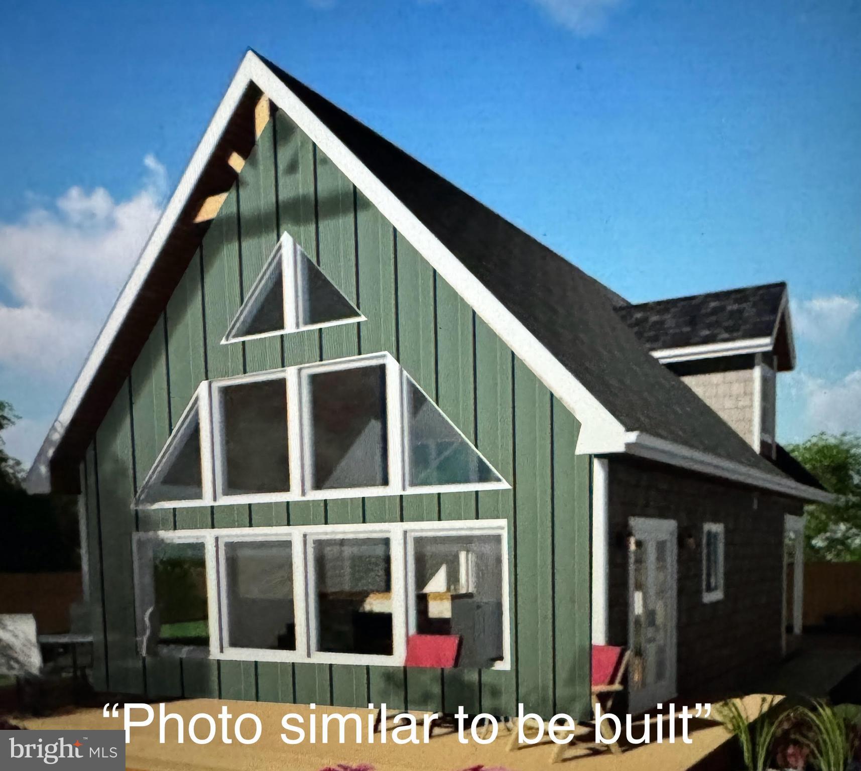 a front view of a house with glass windows