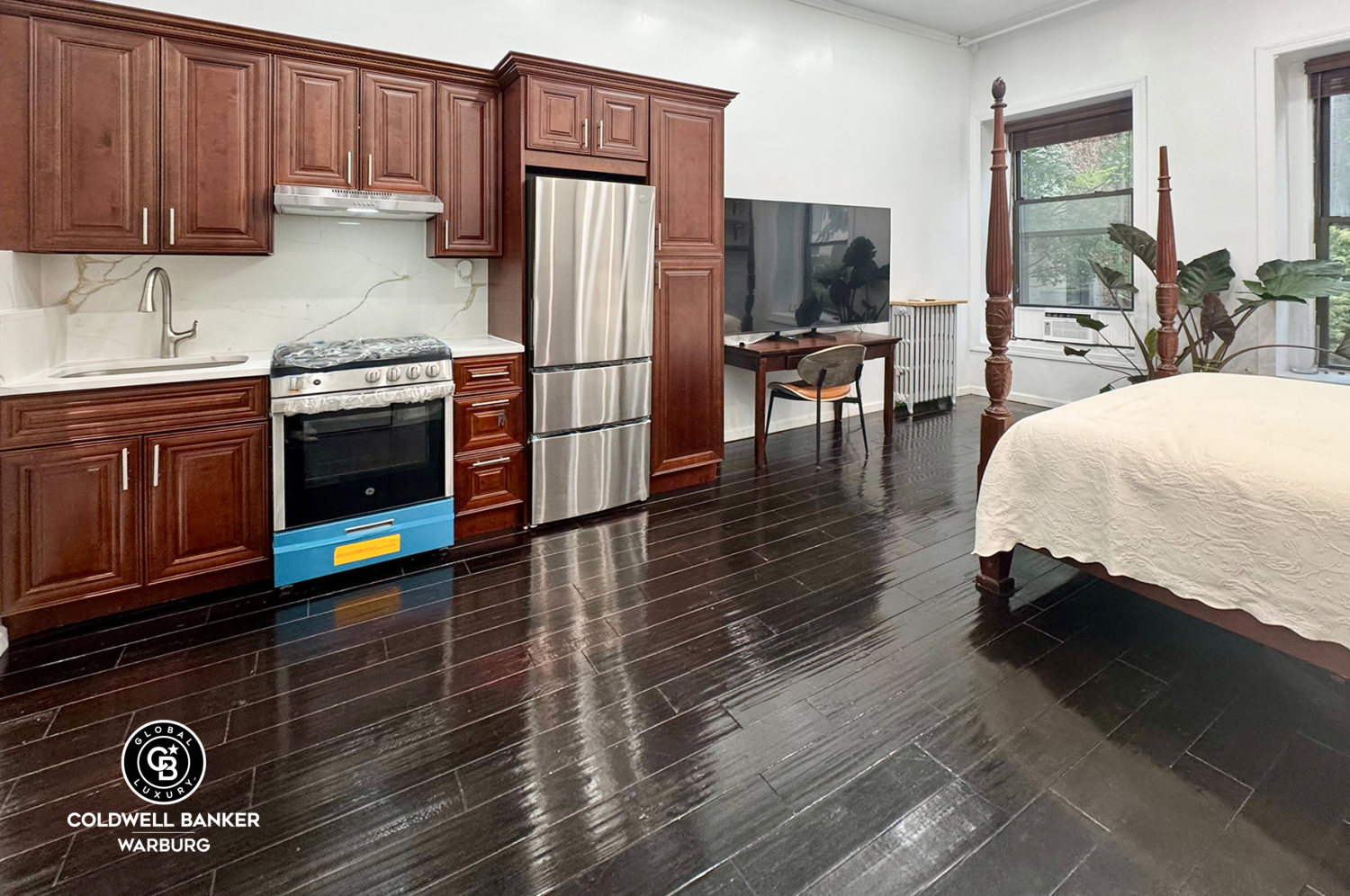 a kitchen with stainless steel appliances granite countertop a refrigerator and a stove top oven