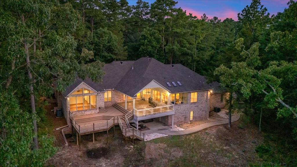 Discover serene living at 3832 Brighton Creek Circle, a tranquil forest retreat boasting expansive decking and inviting natural light.